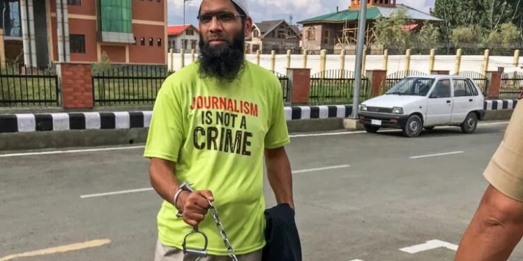 One of the cases highlighted in the BBC report is of Aasif Sultan, a local journalist and assistant editor of the Kashmir Narrator magazine who was arrested in August 2018 [File: Saqib Majeed/SOPA Images/LightRocket via Getty Images]