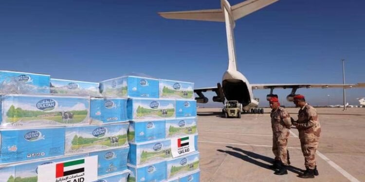 Soldiers at Benina Airport in Libya supervise the arrival of aid from the UAE for survivors of the floods in Derna.