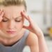 Symptoms of vitamin B12 deficiency include headaches and exhausted
