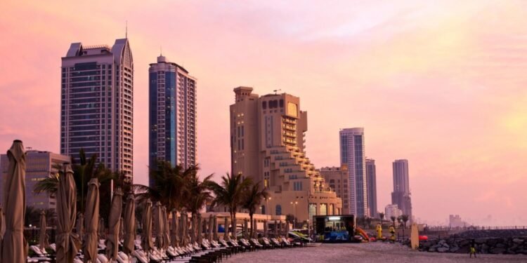 HT73NY Ajman beachfront at dusk, Ajman, UAE