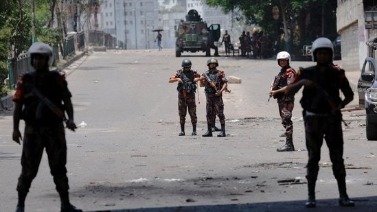 Members of Border Guard Bangladesh (BGB) stand guard outside the state-owned Bangladesh Television as violence erupts after anti-quota protests by students, in Dhaka, Bangladesh. Photo: July 19, 2024