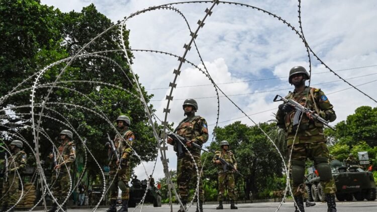 Bangladesh army personnel stand guard near the parliament house amid a curfew following clashes between police and protestors, in Dhaka | AFP photo