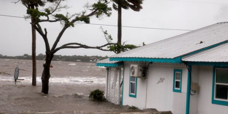 High winds, rain and the storm surge from Hurricane Debby inundate a neighborhood in Cedar Key, Florida Photo: AFP