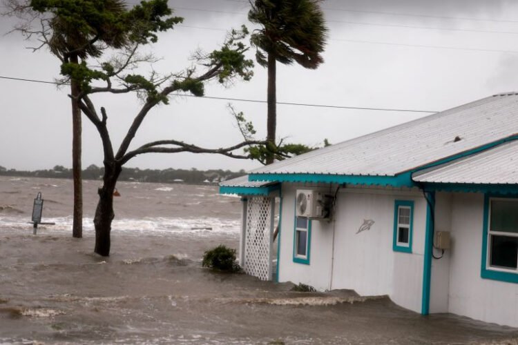 High winds, rain and the storm surge from Hurricane Debby inundate a neighborhood in Cedar Key, Florida Photo: AFP