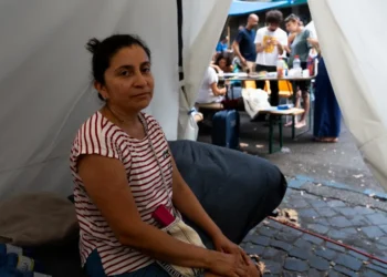 What we know about Hundreds camp on sweltering Rome street amid tussle over squatted building